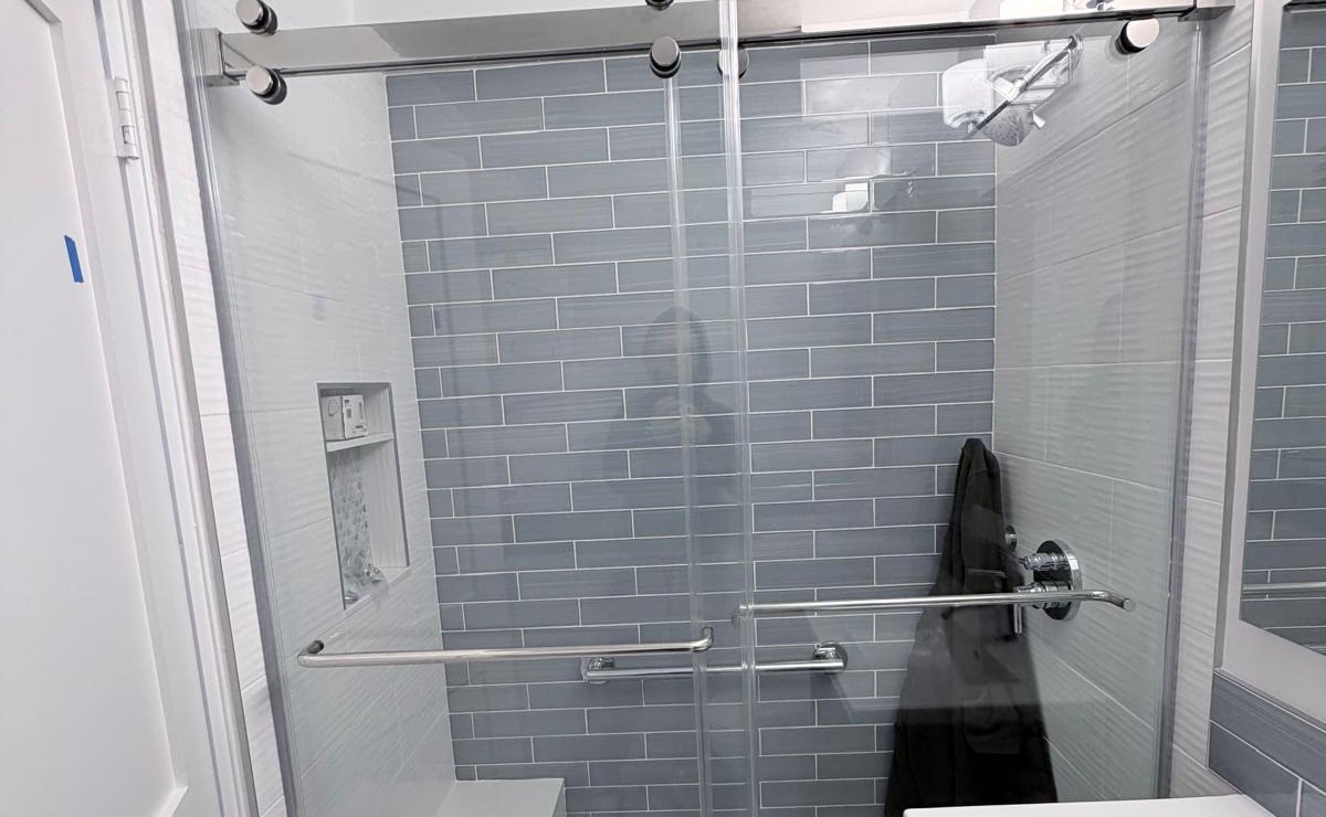 Completed sliding shower door at 84 Clinton in the Lower East Side, Manhattan