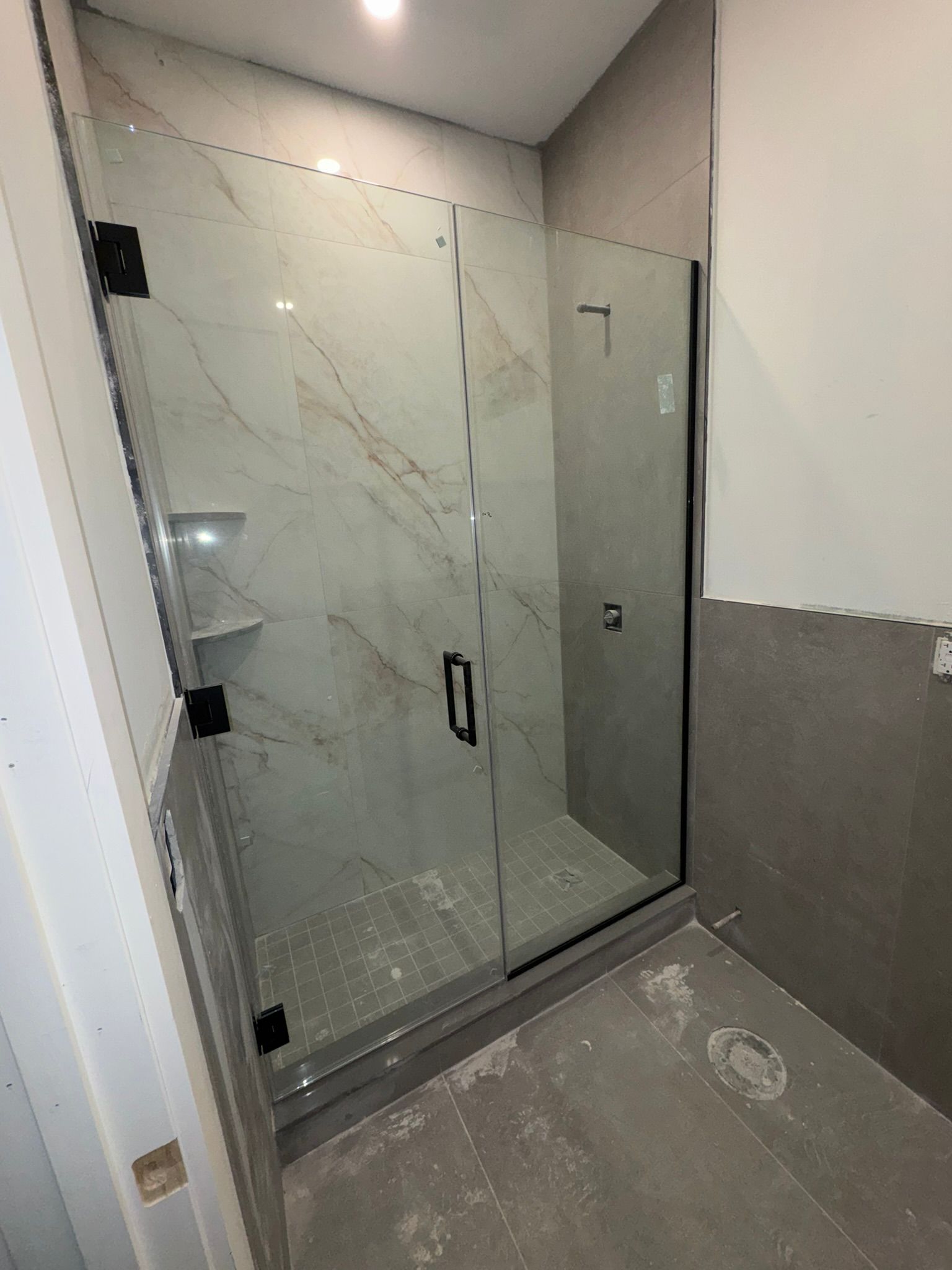 Custom frameless shower enclosure installed by MetroGlass Pro NYC