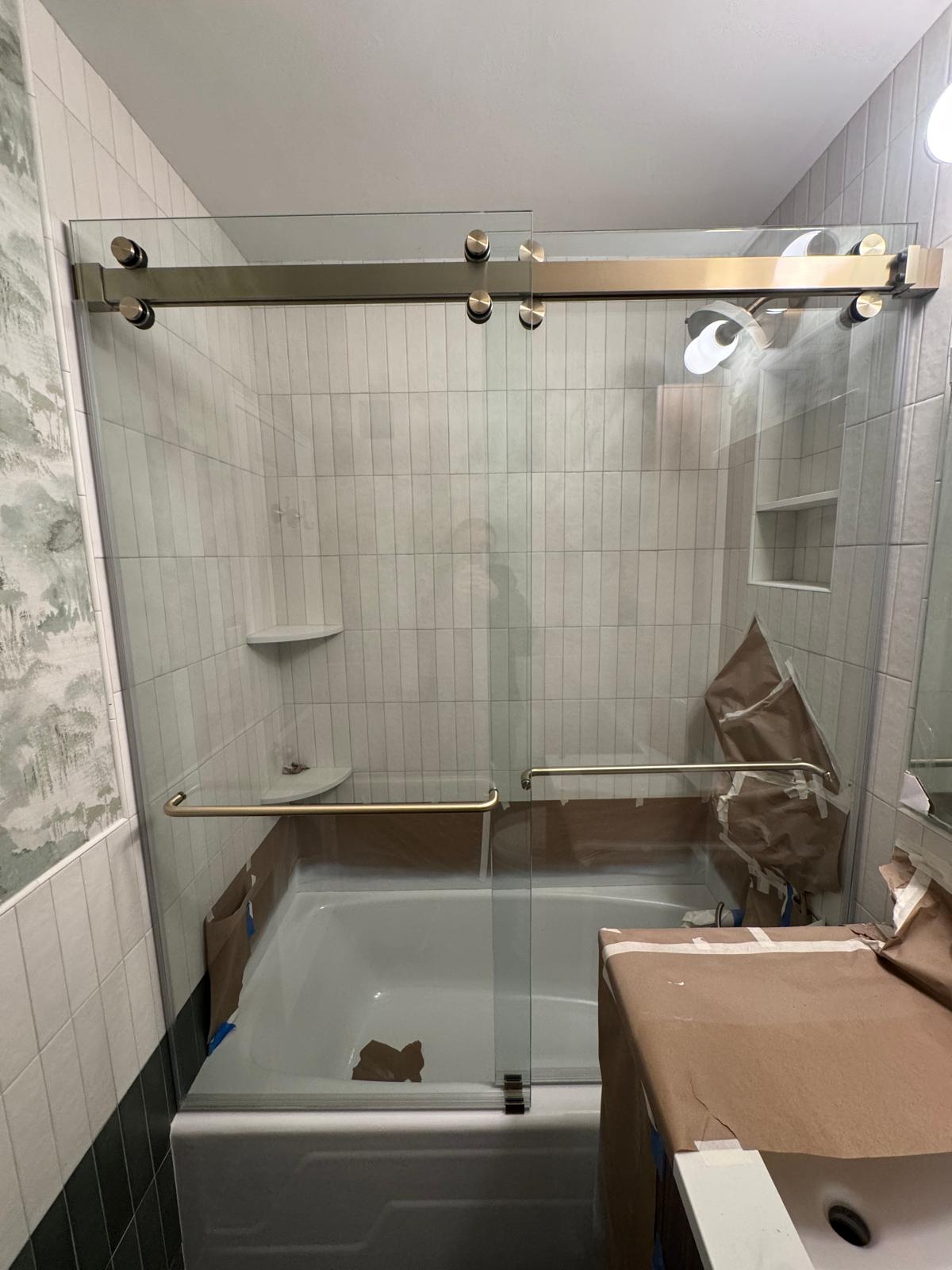 Custom frameless shower enclosure installed by MetroGlass Pro NYC
