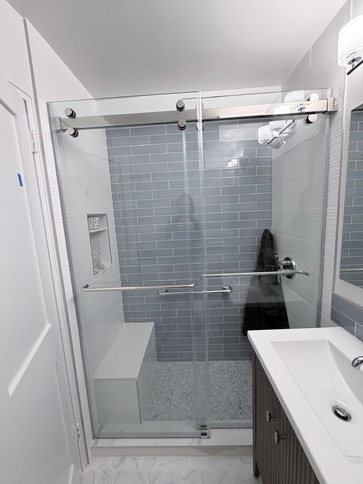 Custom frameless shower enclosure installed by MetroGlass Pro NYC