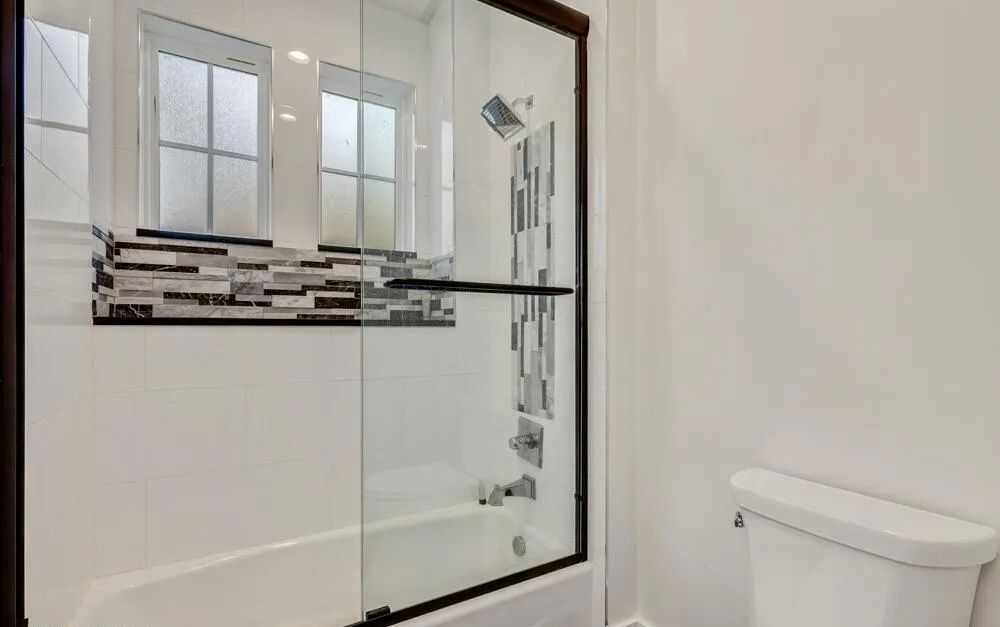 Custom frameless shower enclosure installed by MetroGlass Pro NYC