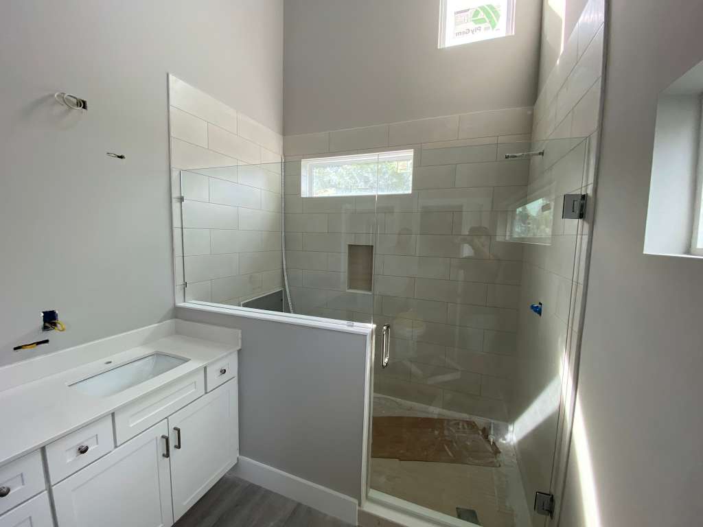 Custom frameless shower enclosure installed by MetroGlass Pro NYC