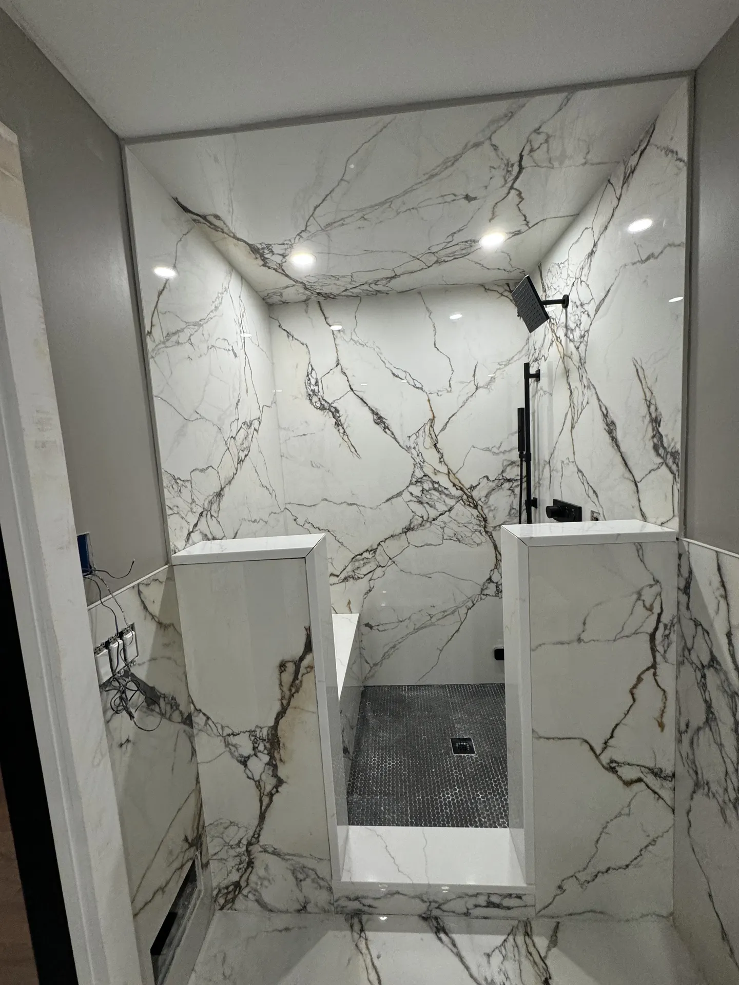 Smoked glass shower door with matte black hardware