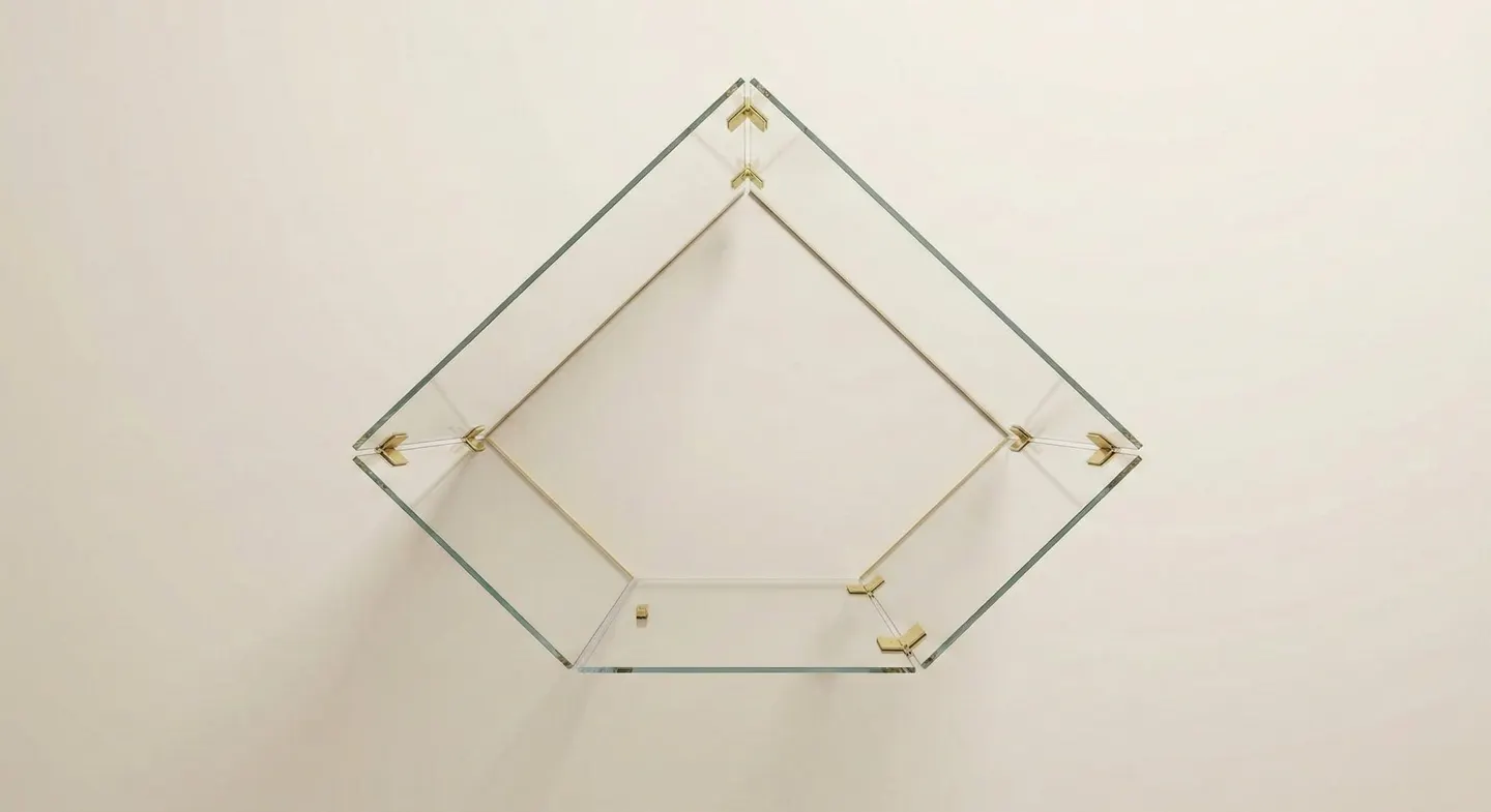 Neo-angle frameless glass enclosure overhead view with brass clamps